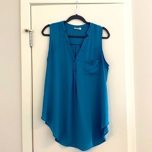 Long turquoise sleeveless blouse by Lush